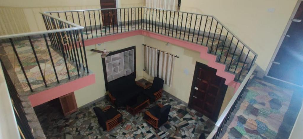 an overhead view of a room with a stair case at Uncle Paul's Mansion in Cochin