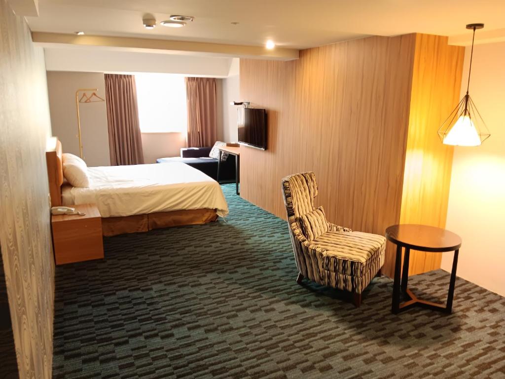 Voodi või voodid majutusasutuse Yiting Hotel toas