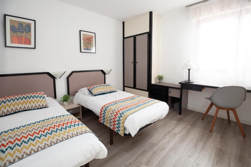 Postel nebo postele na pokoji v ubytování Hotel Atlantide