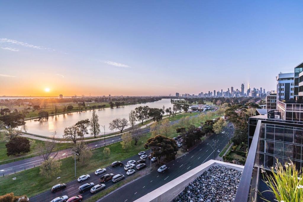 an aerial view of a river with a city at Magnificent Retreat facing Albert Park Lake & CBD in Melbourne