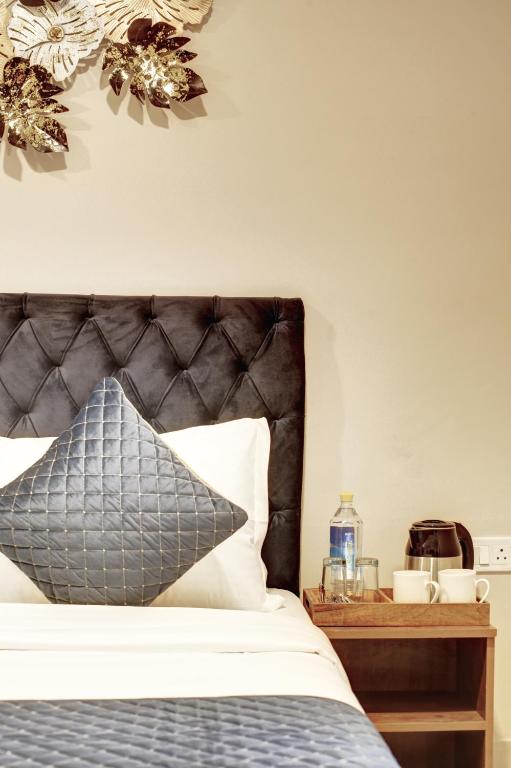 Postel nebo postele na pokoji v ubytování Limewood Stay - Executive Huda City Center