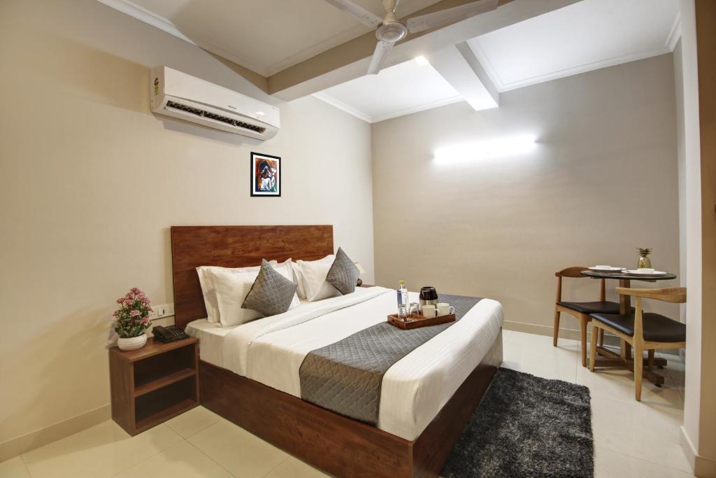 Postel nebo postele na pokoji v ubytování Limewood Stay - Executive Huda City Center