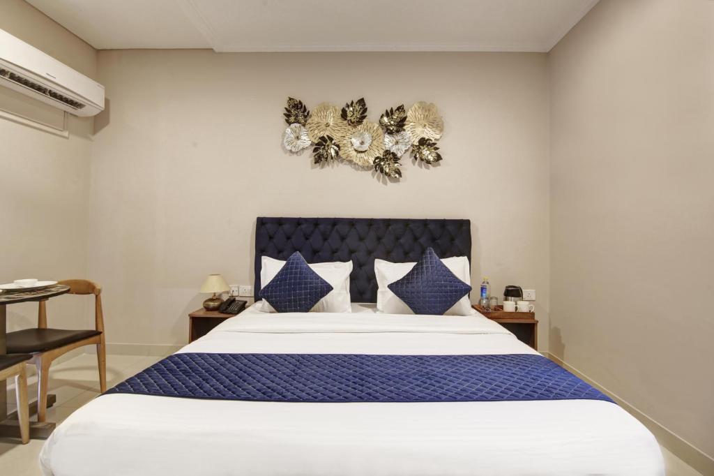Postel nebo postele na pokoji v ubytování Limewood Stay - Executive Huda City Center