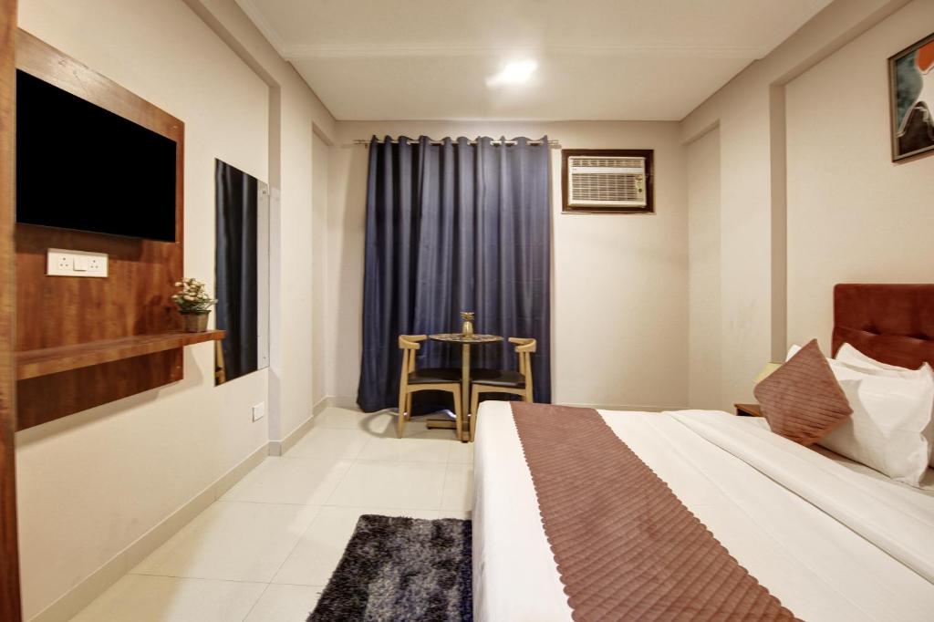 Postel nebo postele na pokoji v ubytování Limewood Stay - Executive Huda City Center