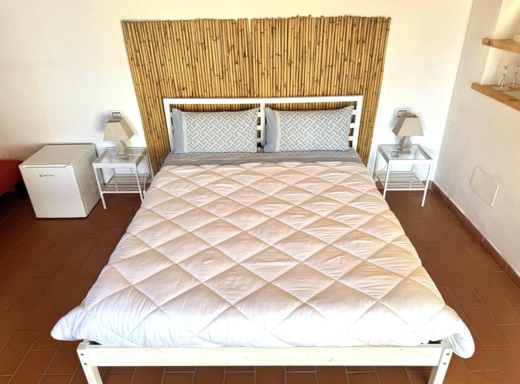 A bed or beds in a room at B&B Alla Fortezza
