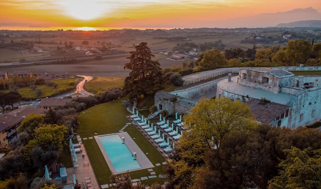 an aerial view of a castle with a swimming pool at Relais Forte Benedek Wine & SPA - Adults Only in Pastrengo