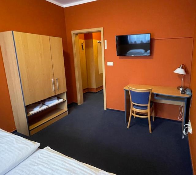 Postel nebo postele na pokoji v ubytování Hotel U Milína
