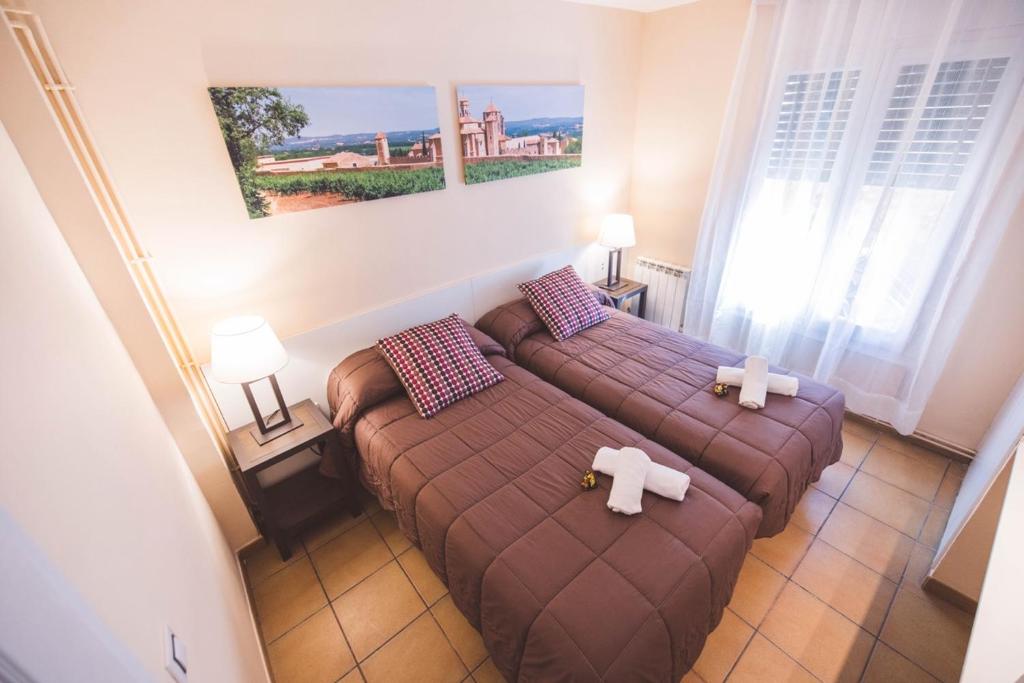 Postel nebo postele na pokoji v ubytování Hotel Rural y Apartamentos Villa Engracia