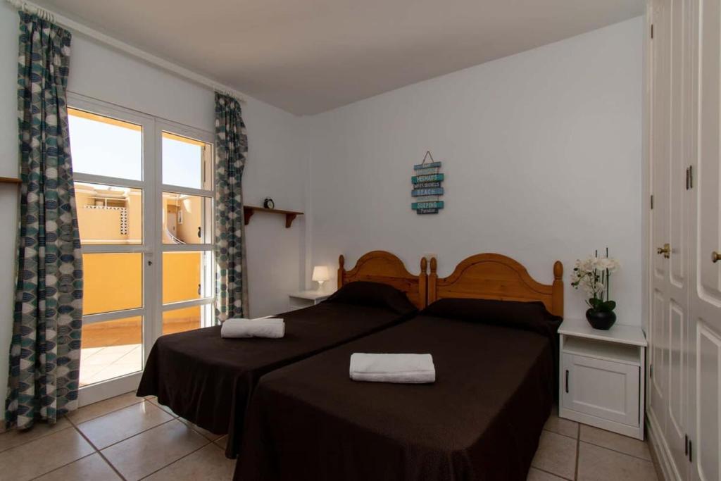 Posteľ alebo postele v izbe v ubytovaní Benimar 13 - Two Bed overlooking the pool