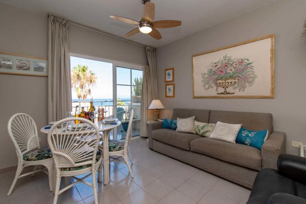 A seating area at Los Olivos 13 - One Bed