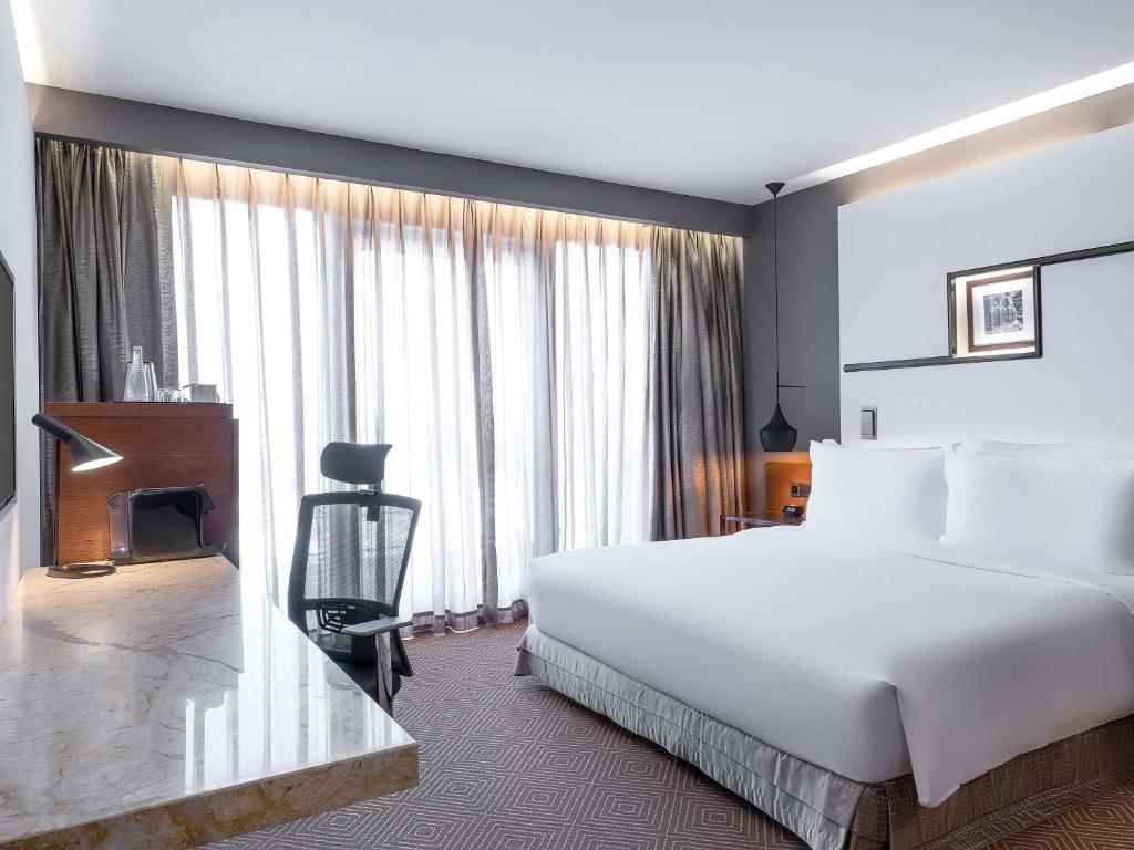 Postel nebo postele na pokoji v ubytování Movenpick Hotel & Convention Centre KLIA