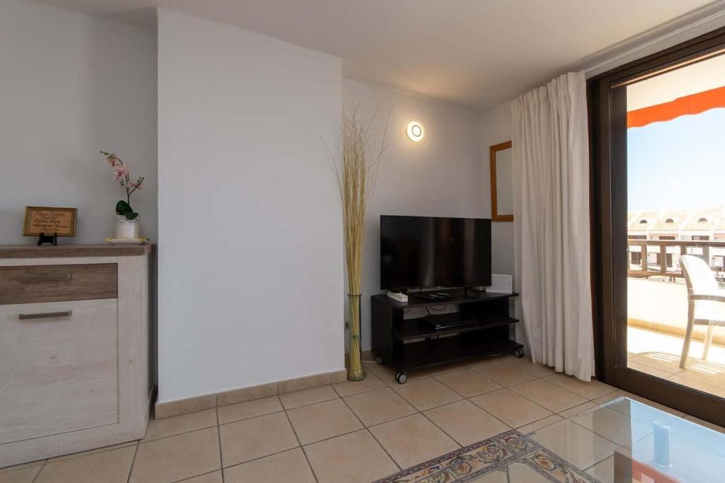 A television and/or entertainment centre at Parque Santiago I 242 - One Bed