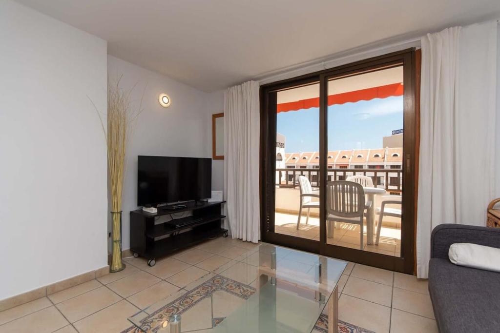 A television and/or entertainment centre at Parque Santiago I 242 - One Bed