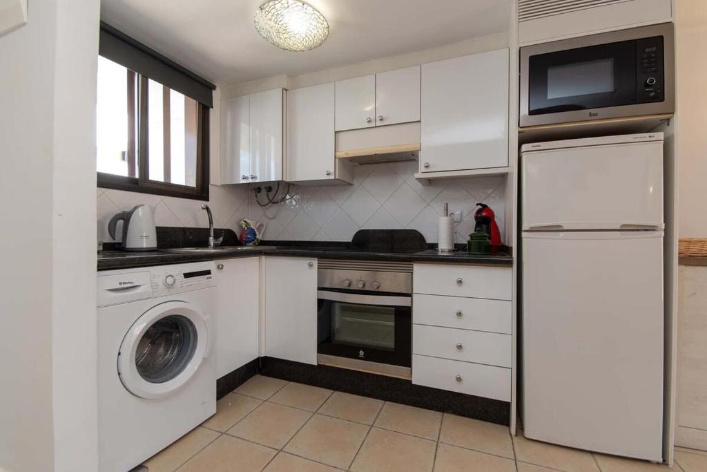 A kitchen or kitchenette at Parque Santiago I 242 - One Bed