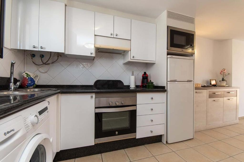 A kitchen or kitchenette at Parque Santiago I 242 - One Bed