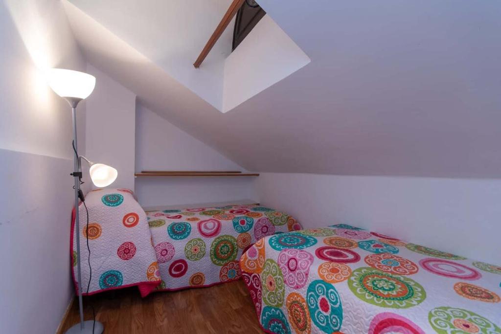 A bed or beds in a room at Parque Santiago I 242 - One Bed
