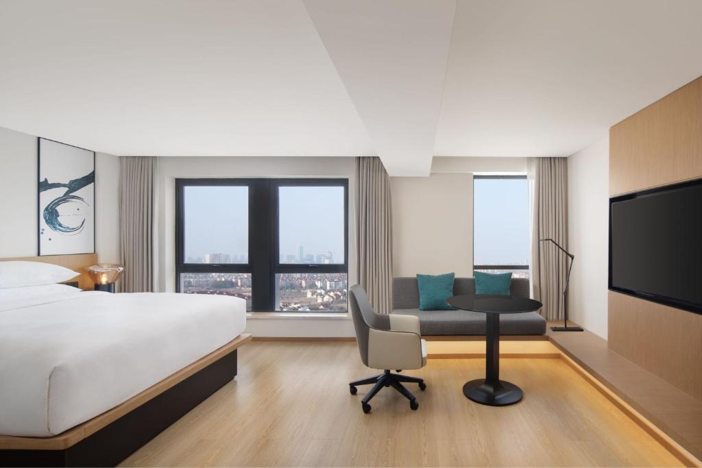 Postel nebo postele na pokoji v ubytování Fairfield by Marriott Shanghai Pudong South