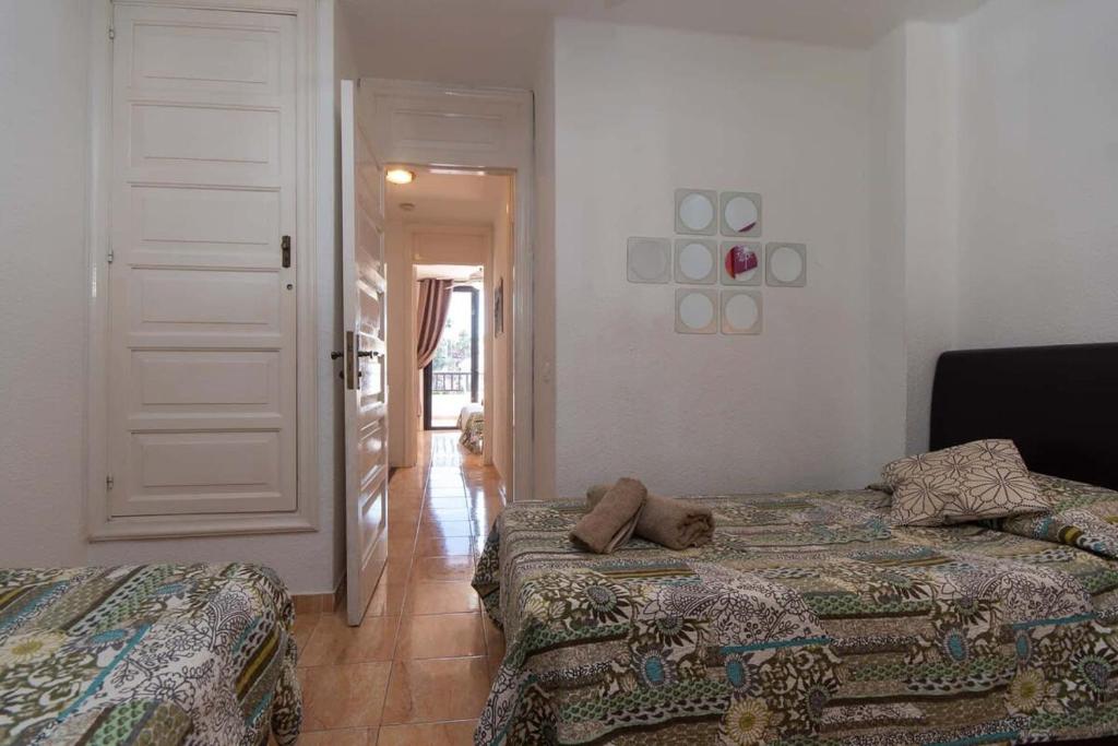 Postel nebo postele na pokoji v ubytování Parque Santiago II 175 - Two Bed