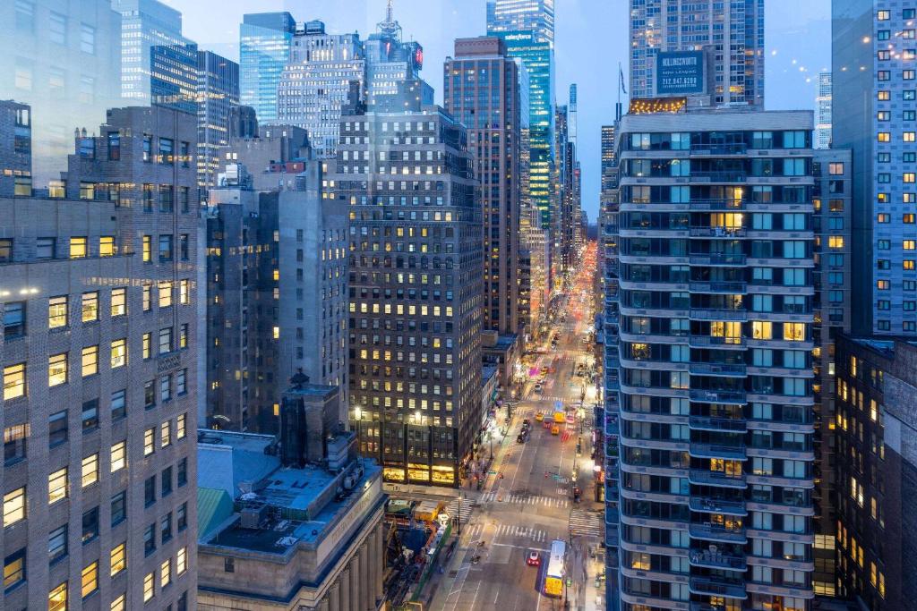 a view of a city street with many tall buildings at The Herald by LuxUrban in New York