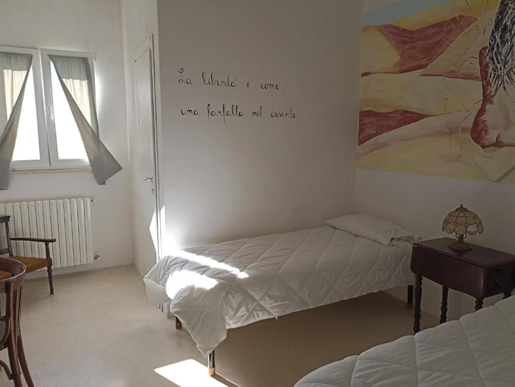 Posteľ alebo postele v izbe v ubytovaní B&B La casa degli artisti