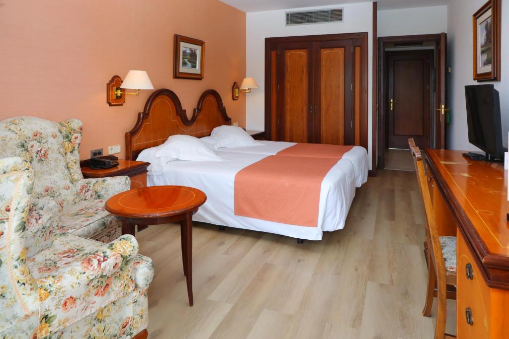Postel nebo postele na pokoji v ubytování Hotel Riu Fluviá