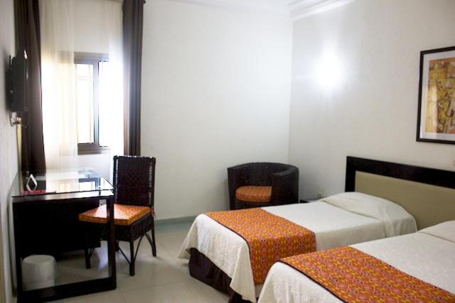 Postel nebo postele na pokoji v ubytování Hotel le Pelican