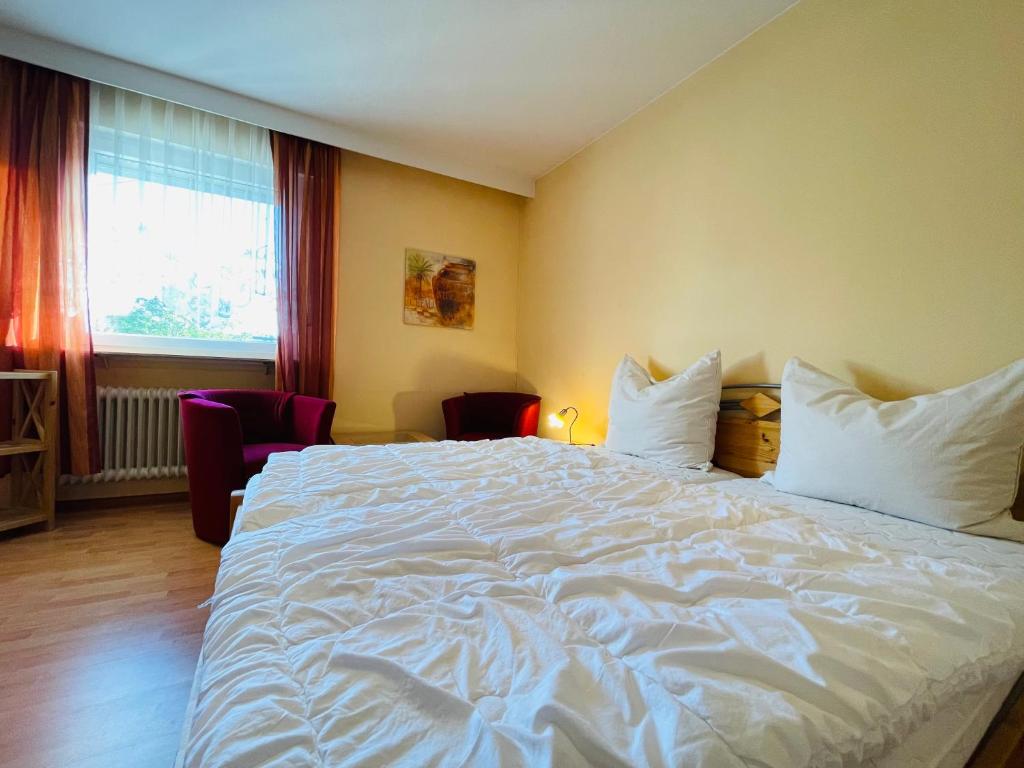 Postel nebo postele na pokoji v ubytování Hotel Ochsen