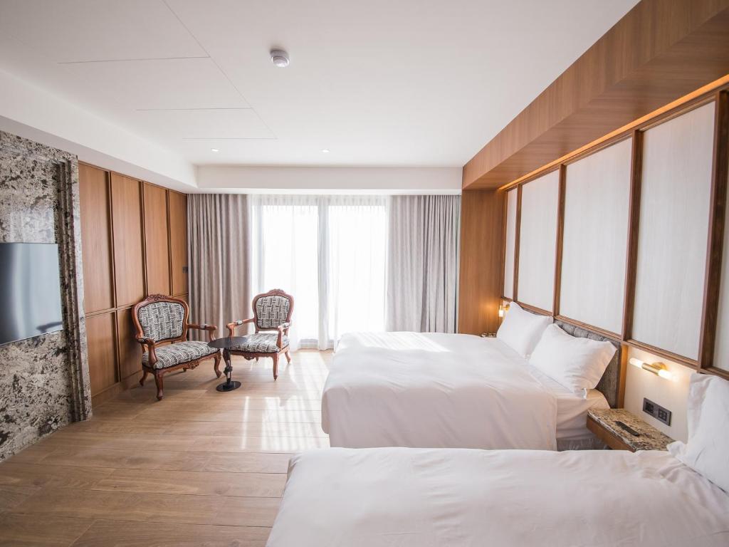 Postel nebo postele na pokoji v ubytování Hôtel de Ľeau