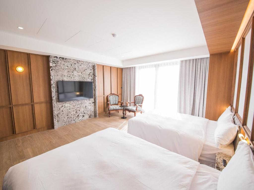 Postel nebo postele na pokoji v ubytování Hôtel de Ľeau