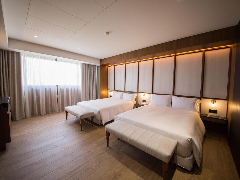 Postel nebo postele na pokoji v ubytování Hôtel de Ľeau