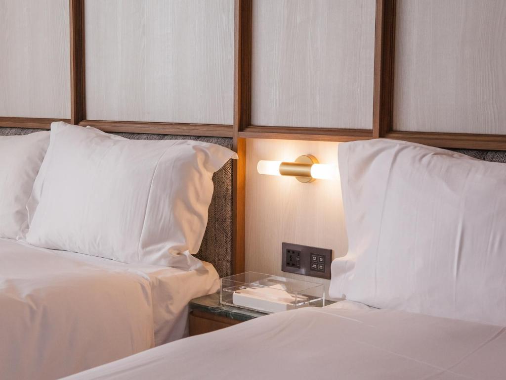 Postel nebo postele na pokoji v ubytování Hôtel de Ľeau