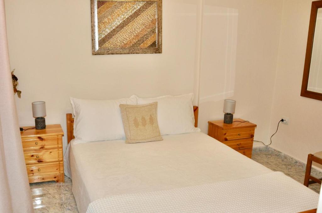 Ένα ή περισσότερα κρεβάτια σε δωμάτιο στο Pineview Serenity Apartment