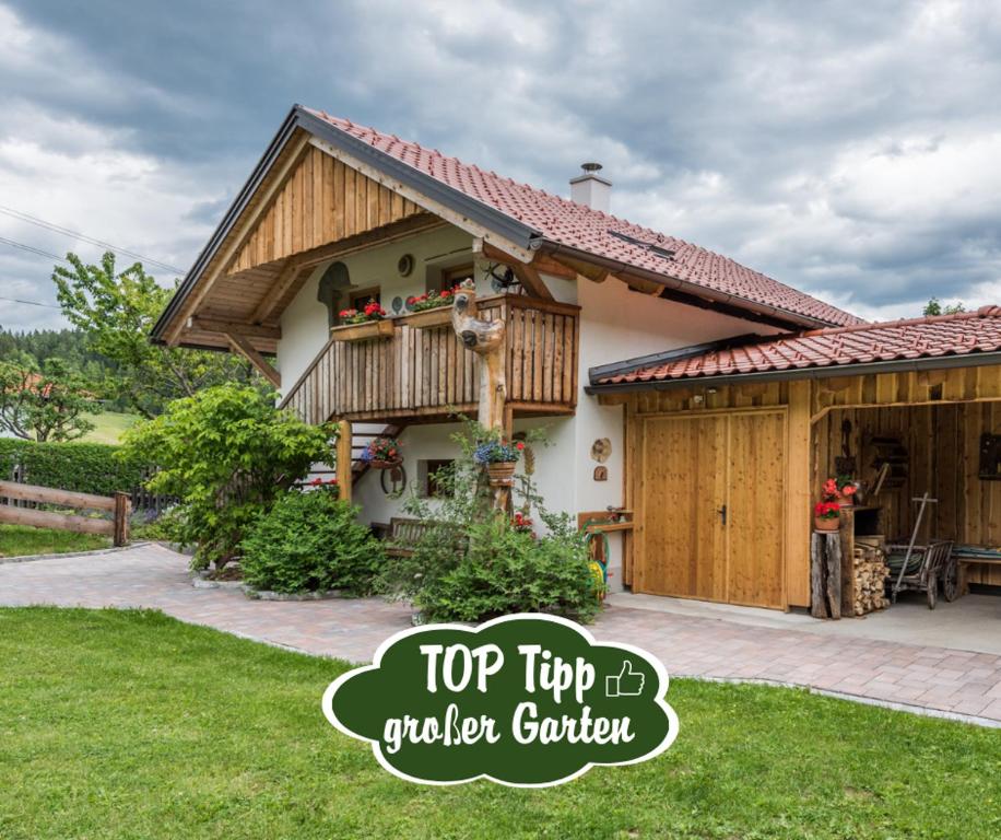 a house with a top tip to a garden garden at Almliesl STGE-483 in Allgaueck