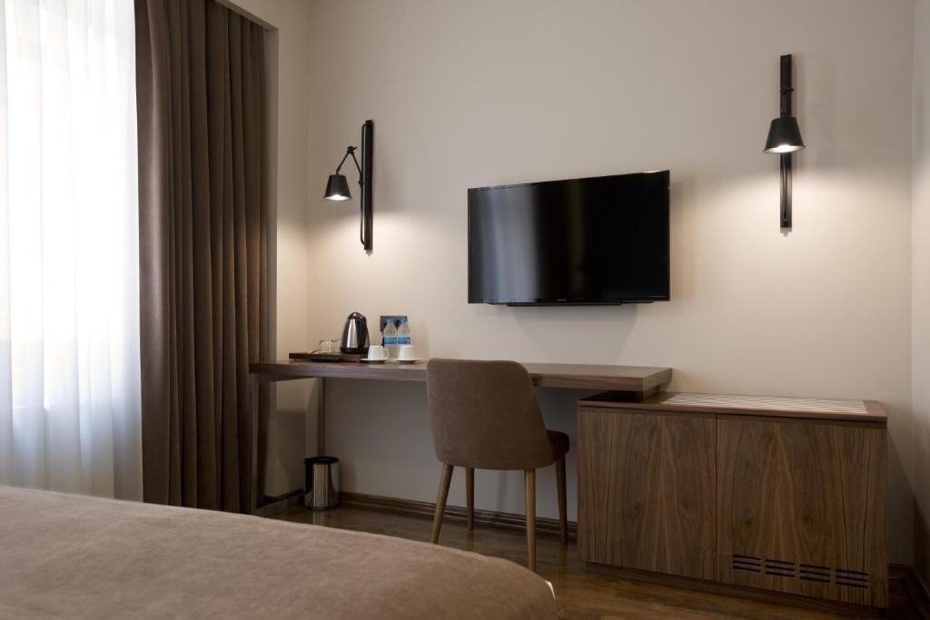 TV a/nebo společenská místnost v ubytování Snog Rooms & Suites