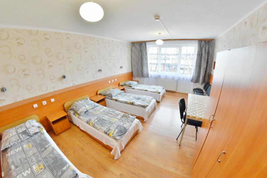 Postel nebo postele na pokoji v ubytování Twój Hostel Ruda Śląska