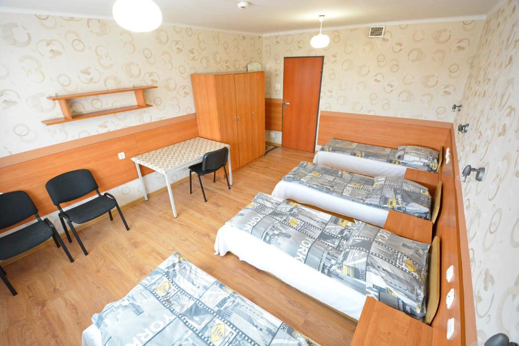 Postel nebo postele na pokoji v ubytování Twój Hostel Ruda Śląska
