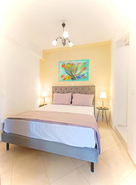 Postel nebo postele na pokoji v ubytování Okeanis Apartments & Suites Adults Only