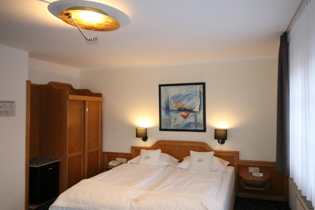 Postel nebo postele na pokoji v ubytování Hotel Trapp