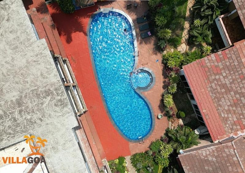 an overhead view of a large swimming pool at Villa Candolim in Candolim