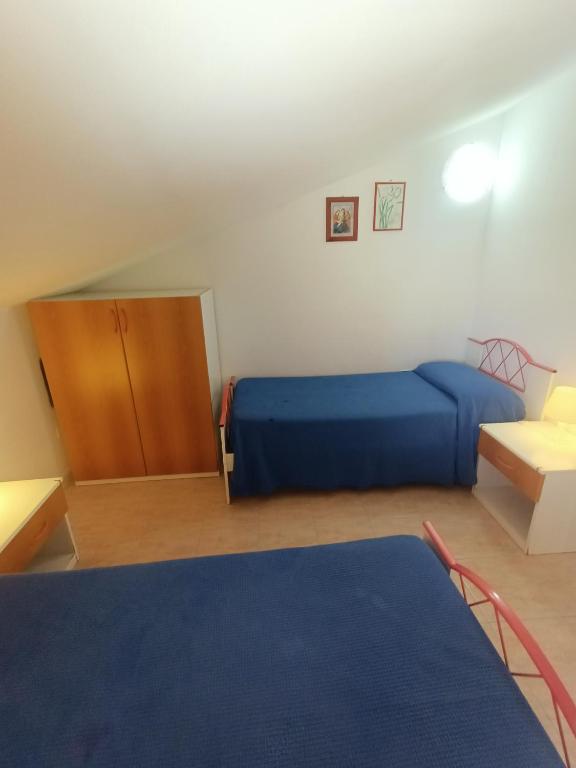 Posteľ alebo postele v izbe v ubytovaní Appartamenti Villa Chiara