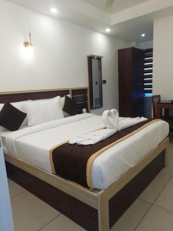Postel nebo postele na pokoji v ubytování PAUL RESIDENCY
