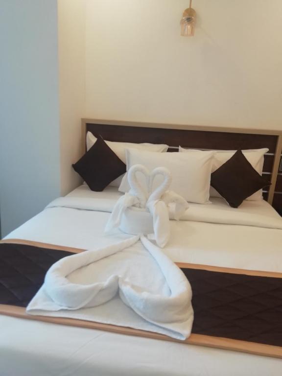 Postel nebo postele na pokoji v ubytování PAUL RESIDENCY