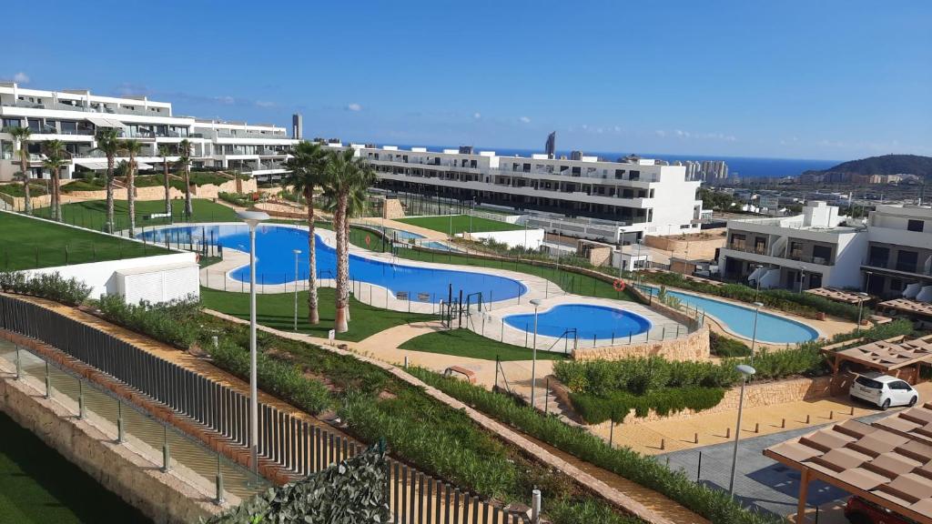 a view of two swimming pools in a resort at Camporrosso Pool View Apartment in Finestrat