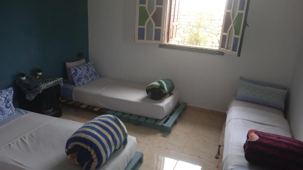 Una cama o camas en una habitación de Villa Rabia