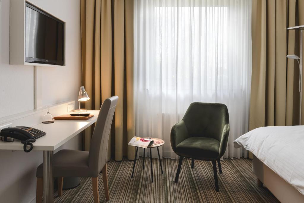 TV a/nebo společenská místnost v ubytování Hotel Astra
