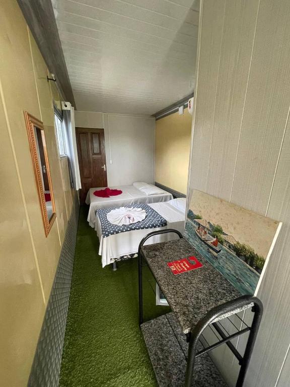 Postel nebo postele na pokoji v ubytování Pousada de Containers