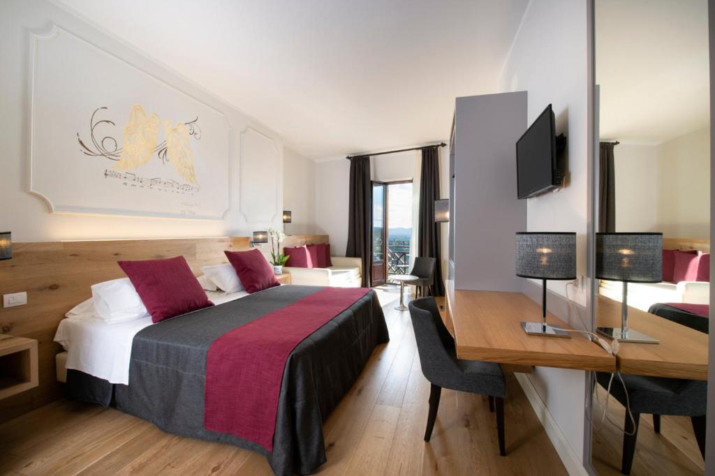 Postel nebo postele na pokoji v ubytování Hotel La Cisterna