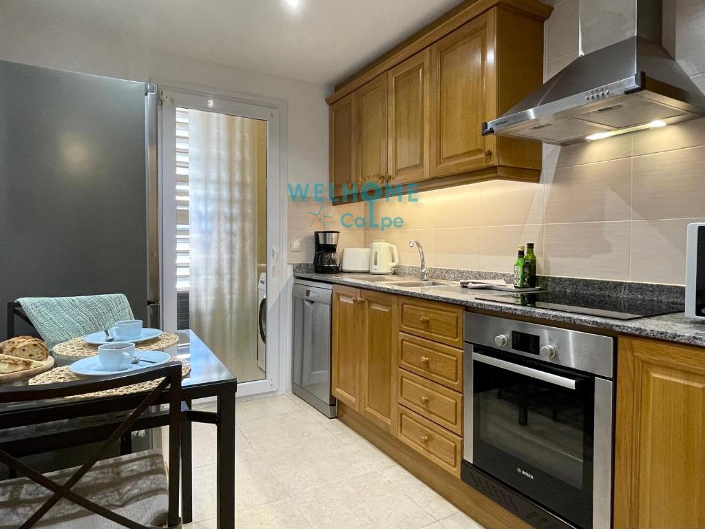 Kuchyň nebo kuchyňský kout v ubytování MANZANA bonito y cómodo apartamento con piscina