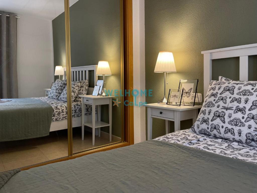 Postel nebo postele na pokoji v ubytování MANZANA bonito y cómodo apartamento con piscina