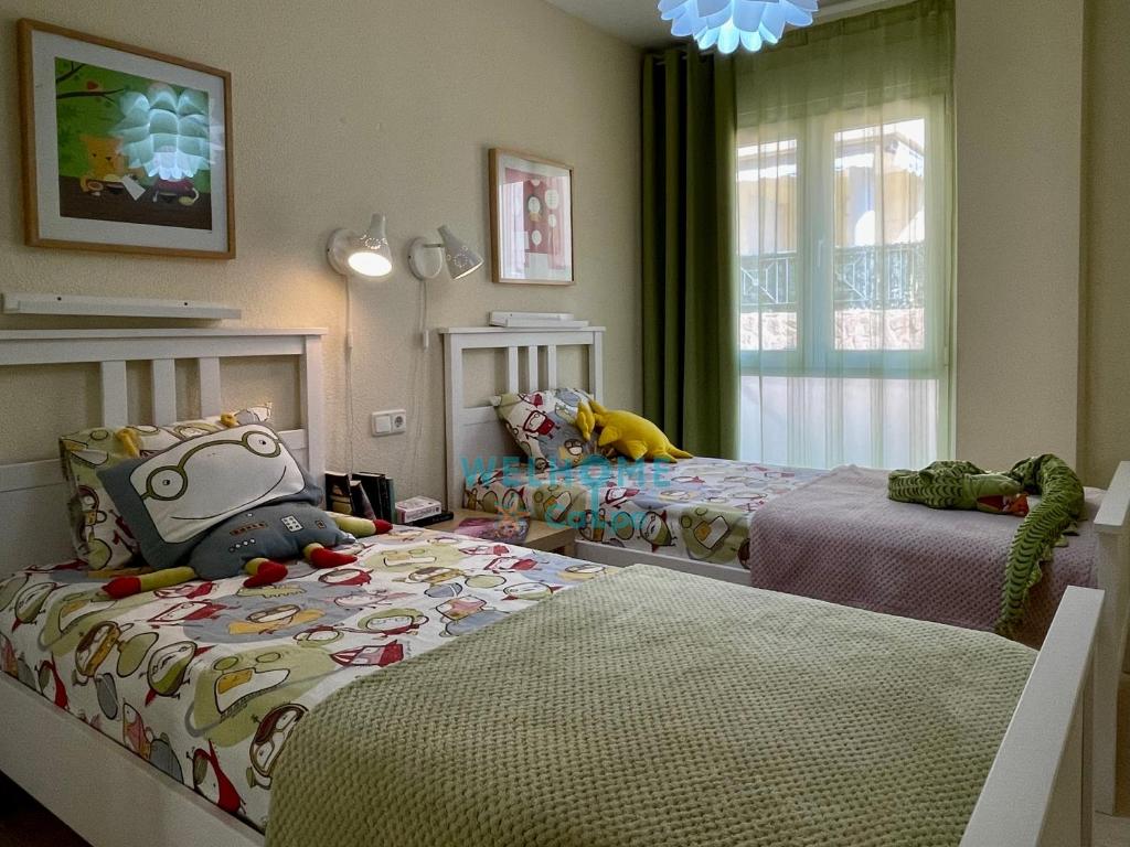 Postel nebo postele na pokoji v ubytování MANZANA bonito y cómodo apartamento con piscina